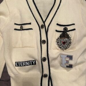 Cream Cardigan with Black Trim and Embellishments